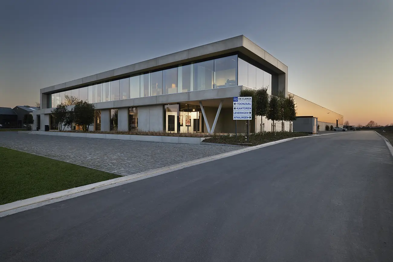 Modern business building designed by WE Architects and photographed by Peter Louies Photography during the evening